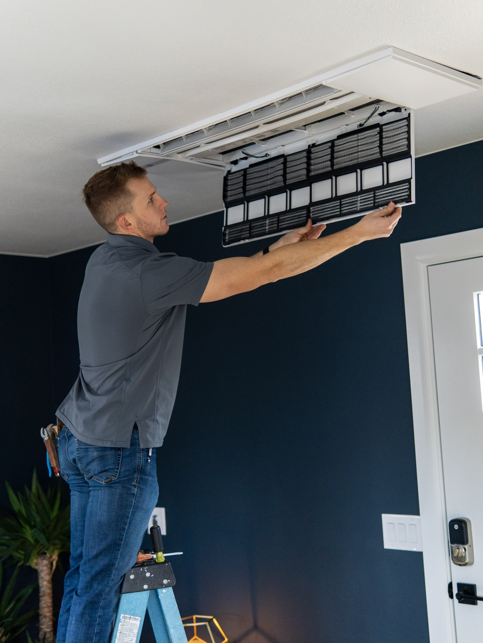 George shows the air filter on the Mitsubishi split-unit he installed for Sky Winston